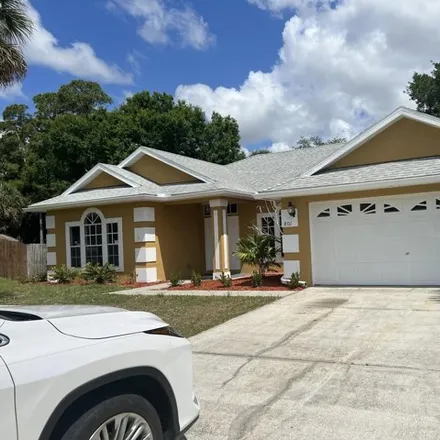 Buy this 3 bed house on 801 Americana Boulevard Northeast in Palm Bay, FL 32907