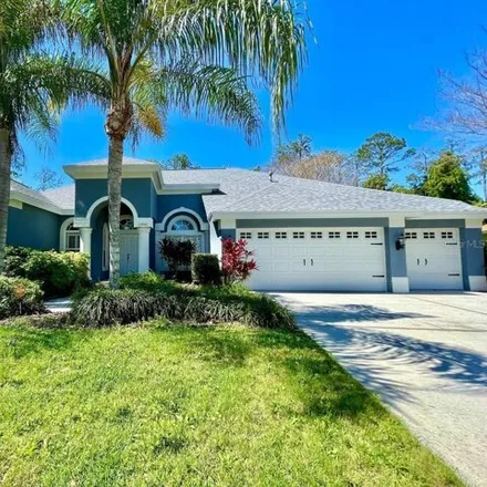 Rent this 4 bed house on 27400 Cedar Park Drive in Seven Oaks, Pasco County