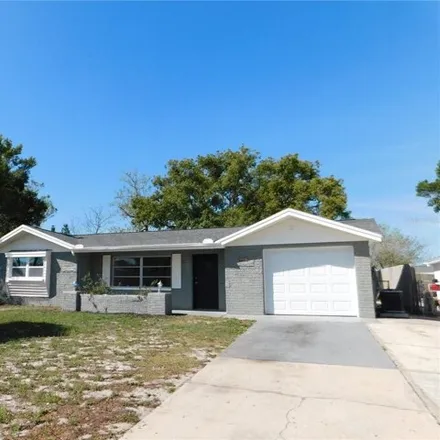 Rent this 3 bed house on 10887 Leeds Road in Bayonet Point, FL 34668