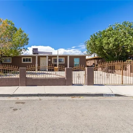 Buy this 4 bed house on 2527 East Cartier Avenue in North Las Vegas, NV 89030