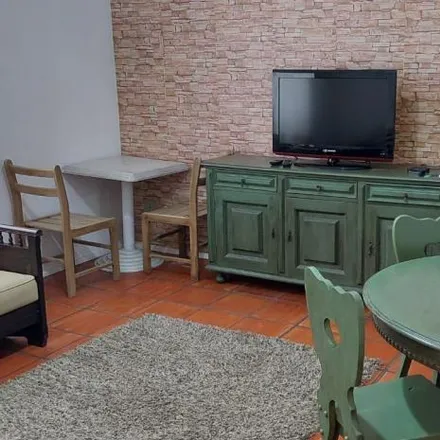 Rent this 2 bed apartment on Avenida Puglisi in Pitangueiras, Guarujá - SP