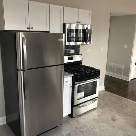 Rent this 3 bed apartment on 8101 South Throop Street in Chicago, IL 60643