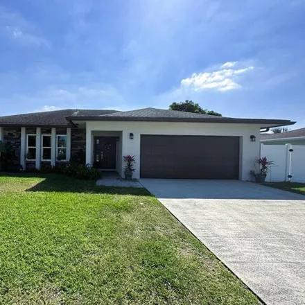 Rent this 3 bed house on Woodstone Circle West in Palm Beach County, FL 33463