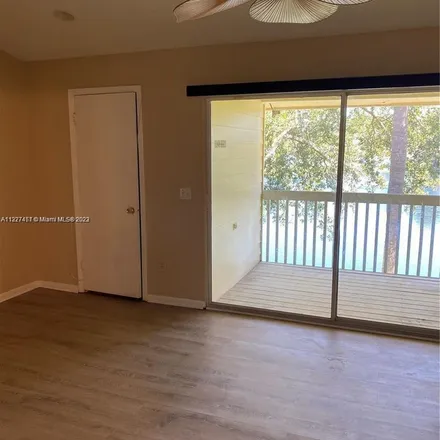 Rent this 2 bed apartment on 2114 Champions Way in North Lauderdale, FL 33068