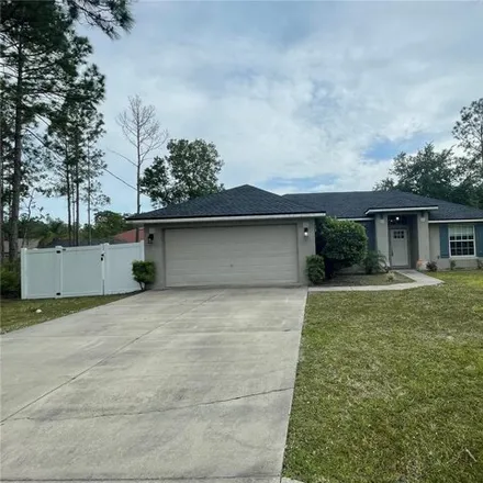 Buy this 3 bed house on Katrina Place in Palm Coast, FL
