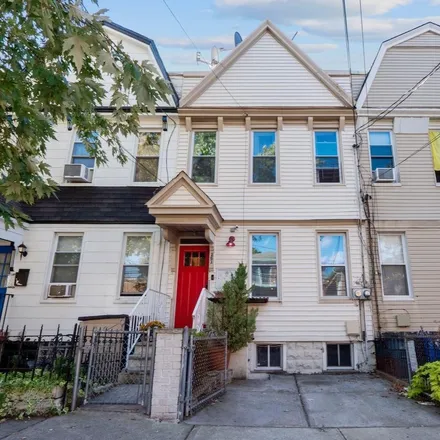 Buy this 4 bed townhouse on 25 Milton Avenue in Jersey City, NJ 07307