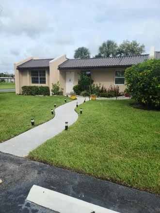 Buy this 2 bed townhouse on 177 Lake Meryl Drive in Golden Lakes, Palm Beach County