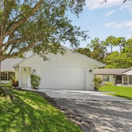 Buy this 4 bed house on 5200 Coral Wood Drive in Vineyards, Collier County