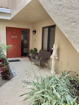 Buy this 2 bed condo on Greens Drive in Palm Beach County, FL 33447