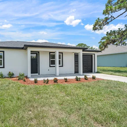 Buy this 3 bed house on 1670 Salazar Street Southeast in Palm Bay, FL 32909