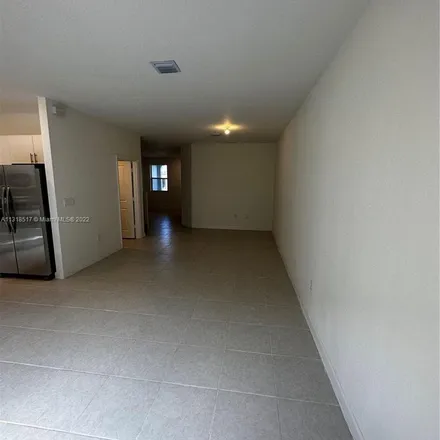 Rent this 3 bed apartment on Southeast 10th Street in Homestead, FL 33035
