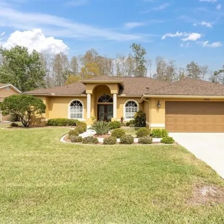 Rent this 4 bed house on 1573 Haverhill Drive in Trinity, FL 34655