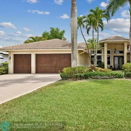 Buy this 5 bed house on 5060 Kensington Circle in Coral Springs, FL 33076