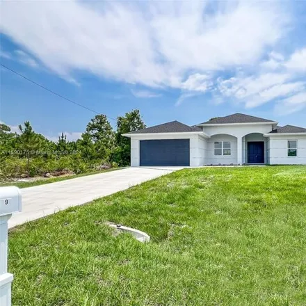 Buy this 4 bed house on Joan Avenue South in Lehigh Acres, FL 33976