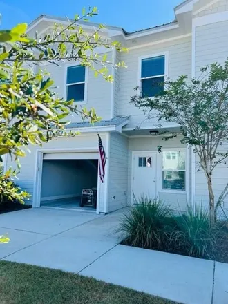 Rent this 3 bed townhouse on 134 North Sand Palm Road in Freeport, Walton County