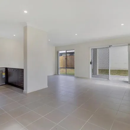 Rent this 4 bed apartment on McPherson Crescent in Coomera QLD, Australia