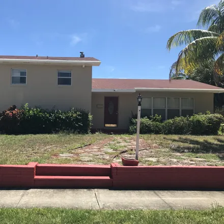 Buy this 5 bed house on 506 Date Palm Drive in Lake Park, Palm Beach County