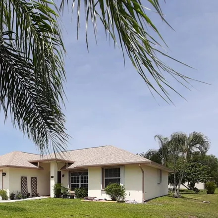 Buy this 3 bed house on 1949 Southwest Brisbane Street in Port Saint Lucie, FL 34984