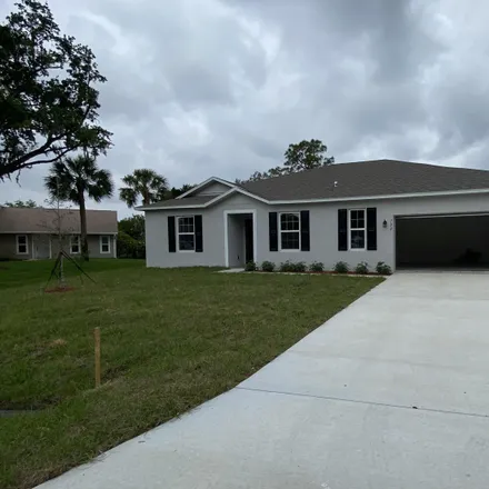 Rent this 4 bed house on 702 Southwest Aster Road in Port Saint Lucie, FL 34953