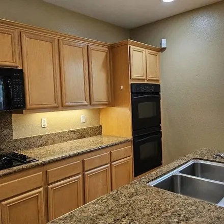 Rent this 4 bed apartment on 27298 Baviera Way in CA 91381, USA