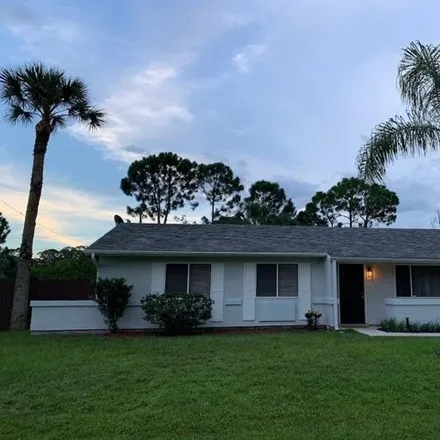 Rent this 3 bed house on 134 Twilight Street Northeast in Palm Bay, FL 32907