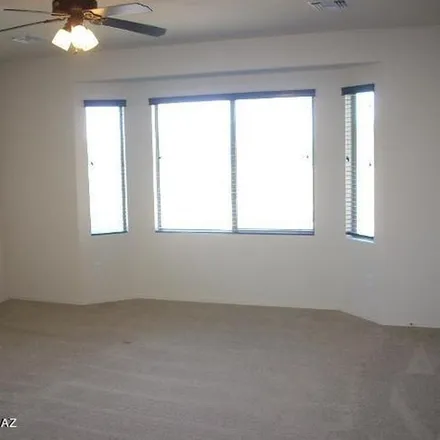 Rent this 3 bed apartment on 11469 North Adobe Village Place in Marana, AZ 85658