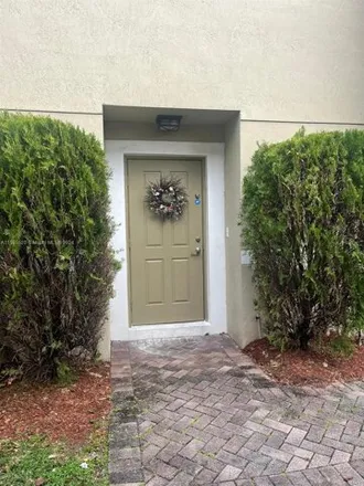 Rent this 3 bed townhouse on 5919 Glasgow Way in Tamarac, FL 33321