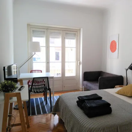 Rent this 4 bed room on Rua de Arroios 85 in 1150-056 Lisbon, Portugal