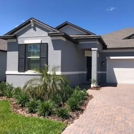 Rent this 3 bed house on Red Bay Loop in Pasco County, FL 34637