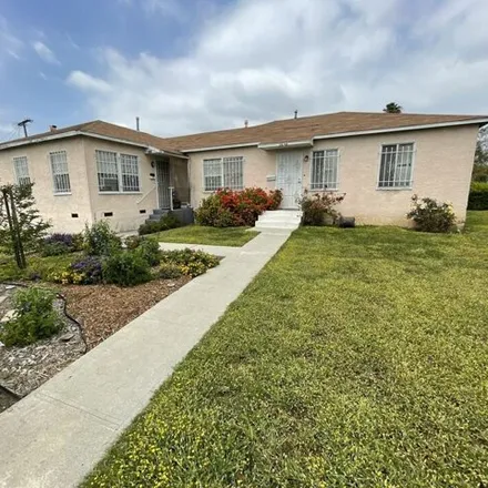 Buy this 4 bed house on 2623 West 30th Street in Los Angeles, CA 90018