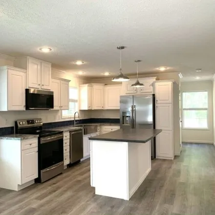 Buy this studio apartment on 159 Millwood Road in Lake County, FL 34788