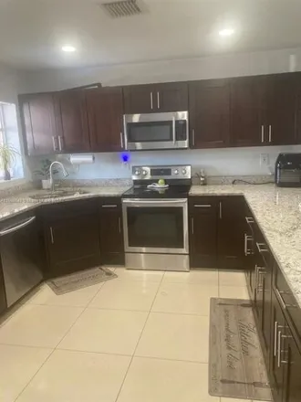 Buy this 5 bed house on 4450 Northwest 171st Terrace in Miami Gardens, FL 33055