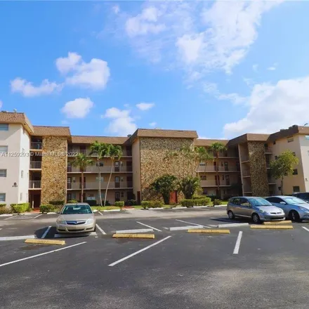 Rent this 2 bed condo on Davie Golf and Country Club in Express Lanes, Davie