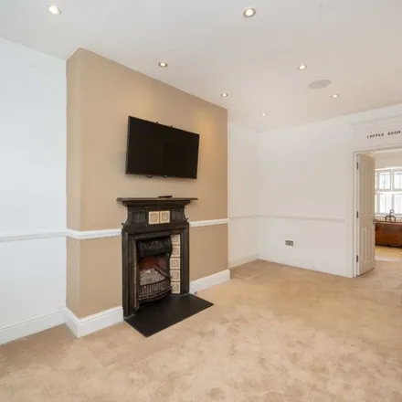 Rent this 5 bed townhouse on Denning Road in London, NW3 1ST