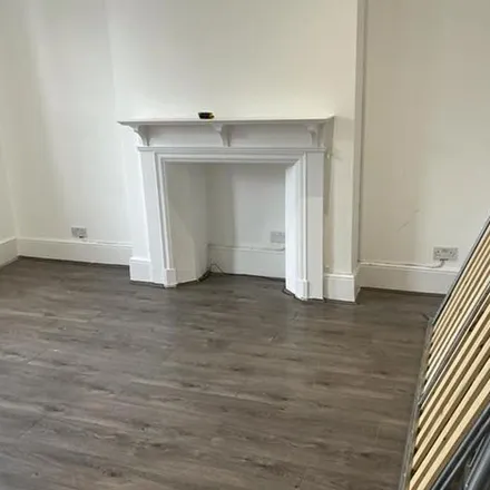 Rent this 4 bed apartment on Pound Saver in Kilburn High Road, London