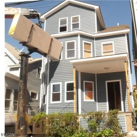 Buy this 9 bed townhouse on 201 Harrison Street in Paterson, NJ 07501