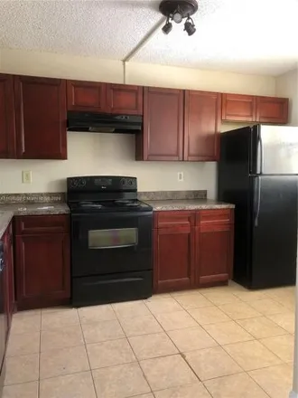 Buy this 2 bed condo on Northwest 28th Drive in Coral Springs, FL 33065