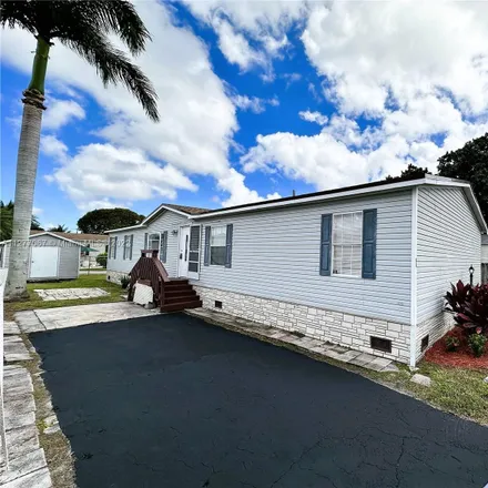 Buy this 4 bed house on 105 Northeast 12th Avenue in Four Seasons Mobile Home Park, Homestead