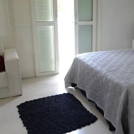 Rent this 4 bed house on Rua São Paulo in Vila Itapema, Guarujá - SP
