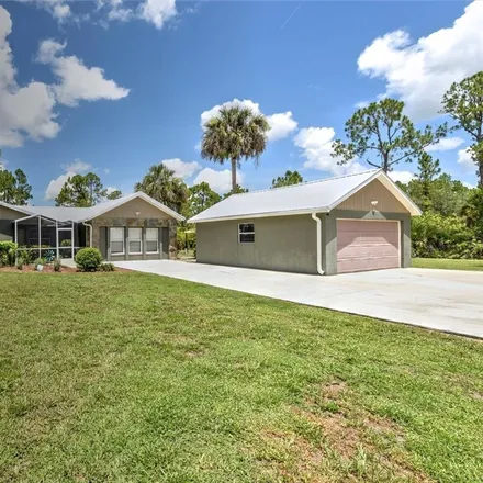 Buy this 3 bed house on 2331 Wells Avenue in Lehigh Acres, FL 33920