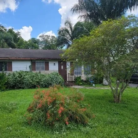 Buy this 4 bed house on 625 Northwest 14th Street in Belle Glade, FL 33430