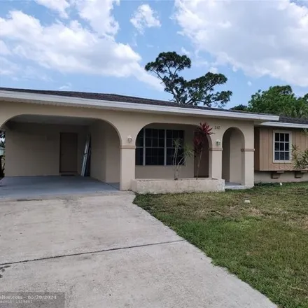 Rent this 3 bed house on 234 Southwest Reynolds Avenue in Port Saint Lucie, FL 34983