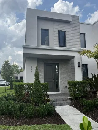 Rent this 4 bed townhouse on Northwest 3rd Avenue in Middle River Vista, Fort Lauderdale