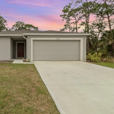 Rent this 4 bed house on 1256 Larkspur Avenue Southeast in Palm Bay, FL 32909
