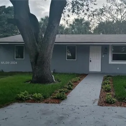 Rent this 3 bed house on 2834 Washington Drive in Washington Park, Broward County