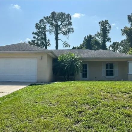 Rent this 3 bed house on 653 Summit Avenue in Lehigh Acres, FL 33974