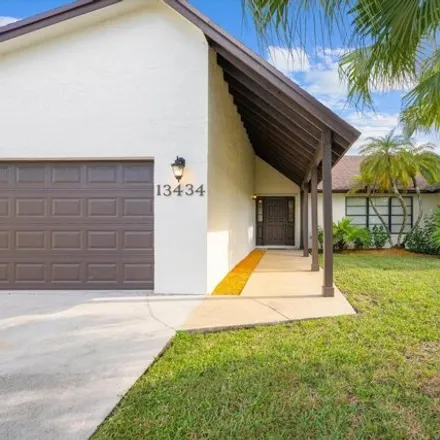 Rent this 4 bed house on Exotica Lane in Wellington, FL 33414