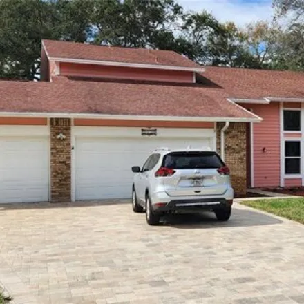 Buy this 4 bed house on 1550 Chateau Wood Dr in Clearwater, Florida