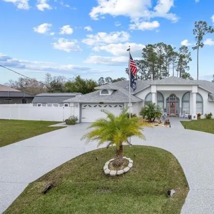 Buy this 4 bed house on Grand Club Cypress Course in Erickson Place, Palm Coast