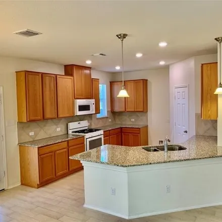 Rent this 3 bed house on Buttercup Creek Boulevard in Cedar Park, TX 78613